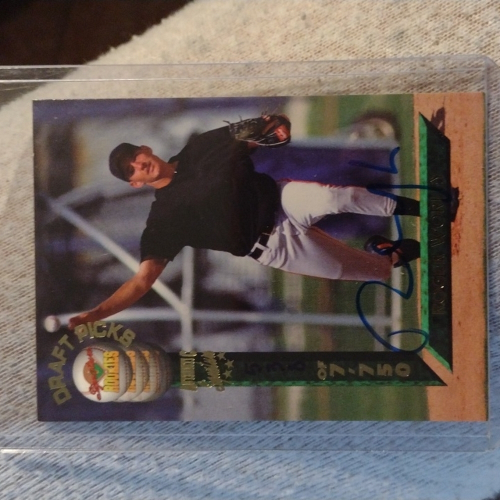 Roger Worley autographed baseball card in protective cover.